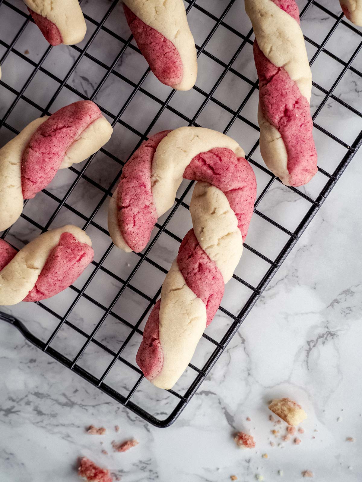 Candy cane cookies on a cooling rack