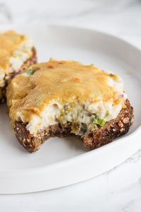 vegan bean "tuna" melt on a plate with bite out
