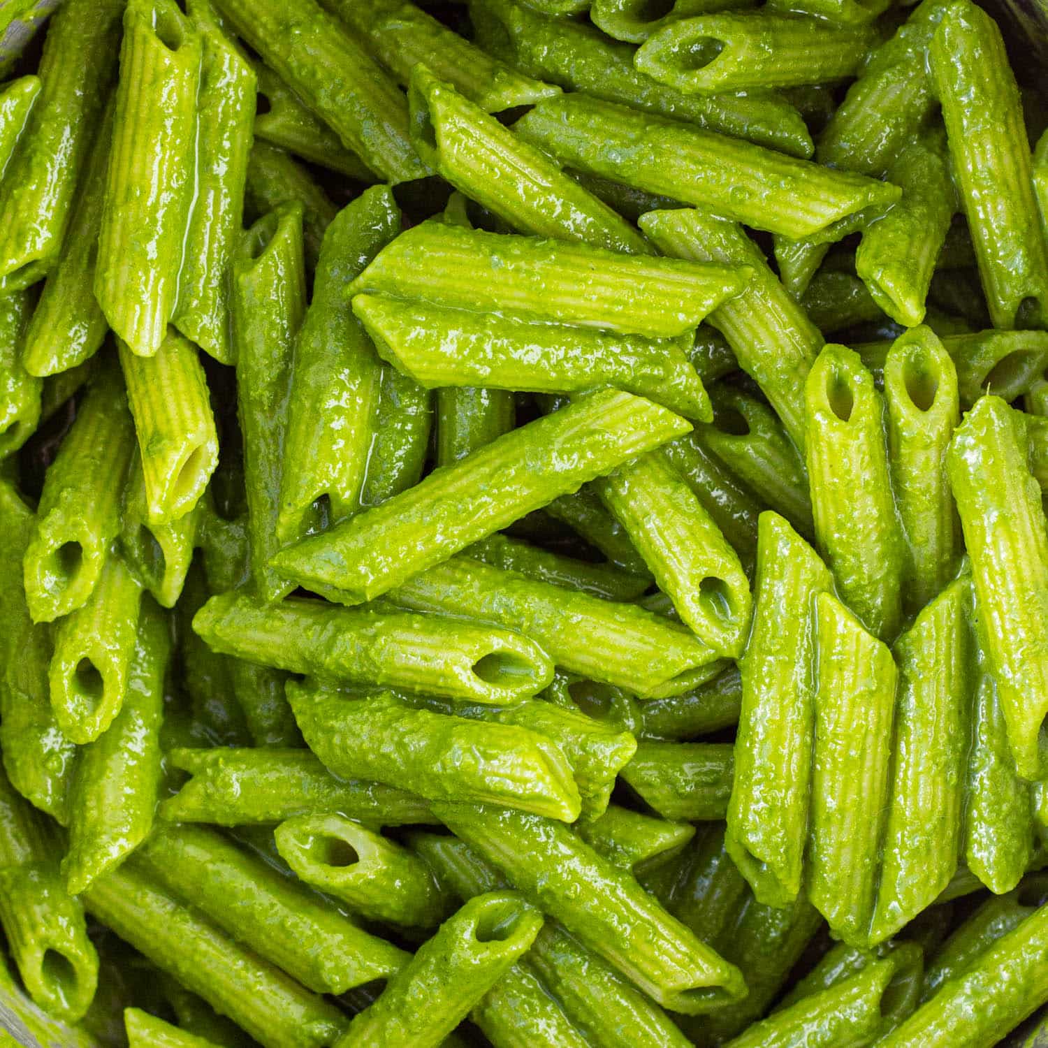 close up of pasta covered in kale sauce