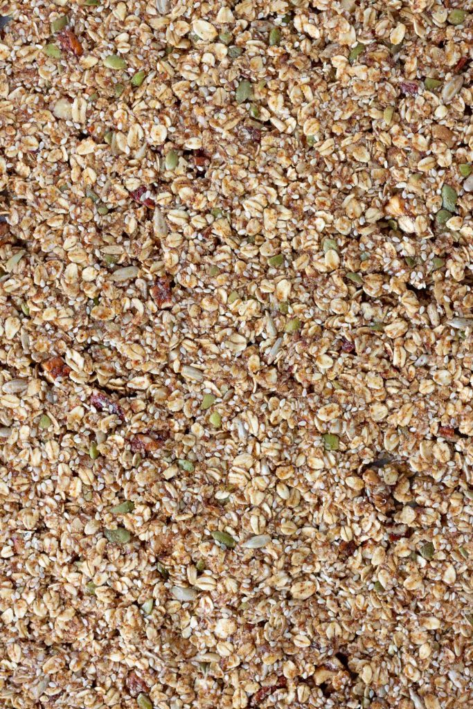 close up of uncooked granola on baking tray